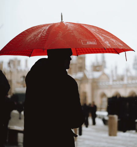 a man holding a printed umbrella