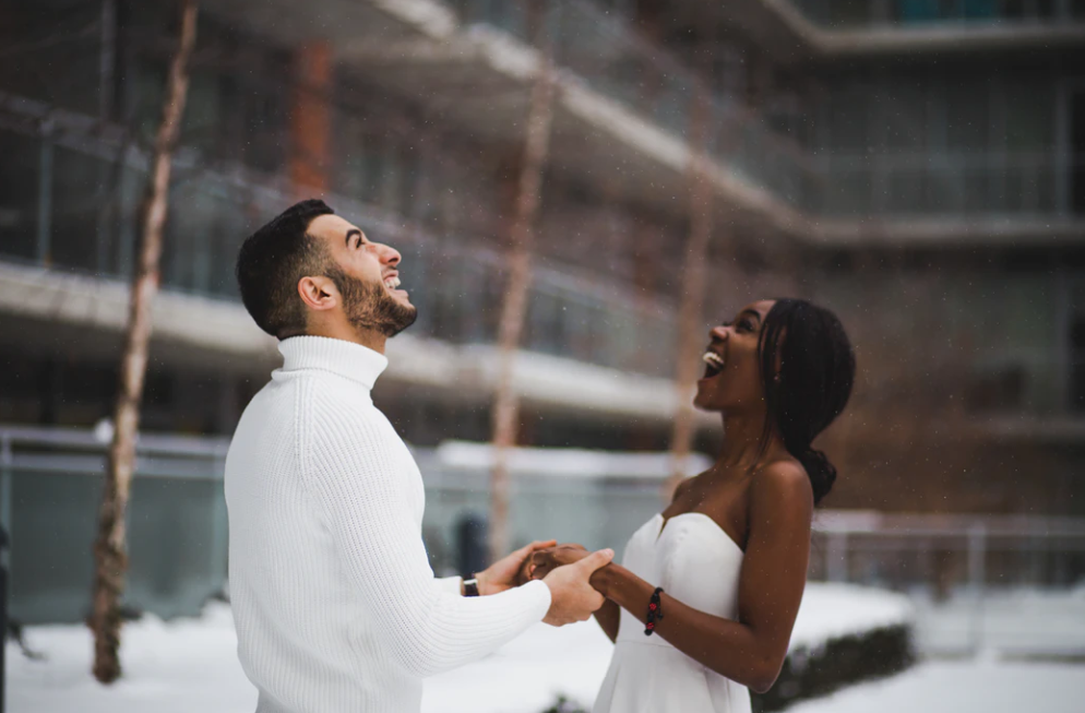 a bride and groom in the snow