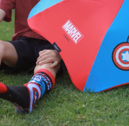 a branded Blunt umbrella and a childs leg