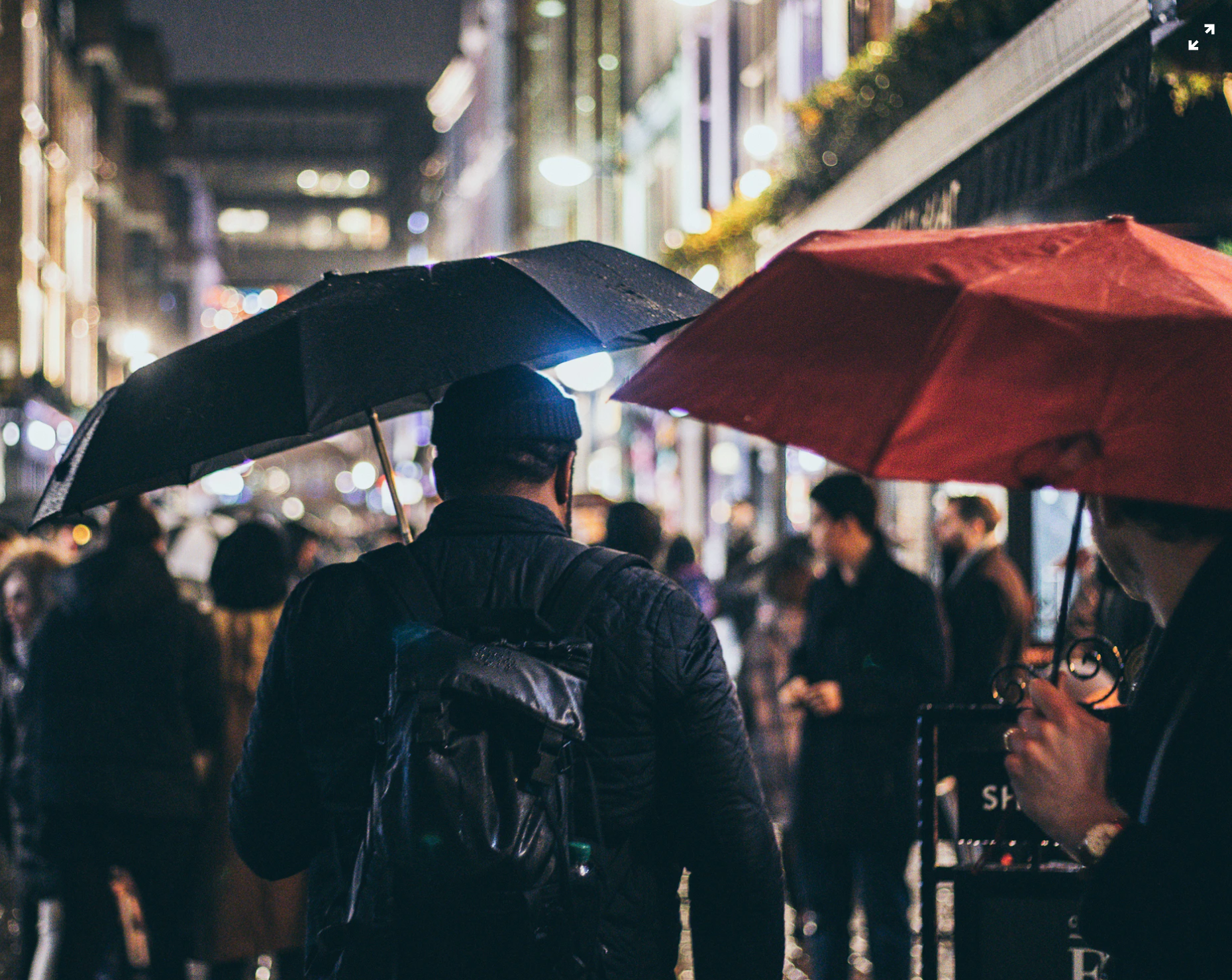 busy street men with umbrellas