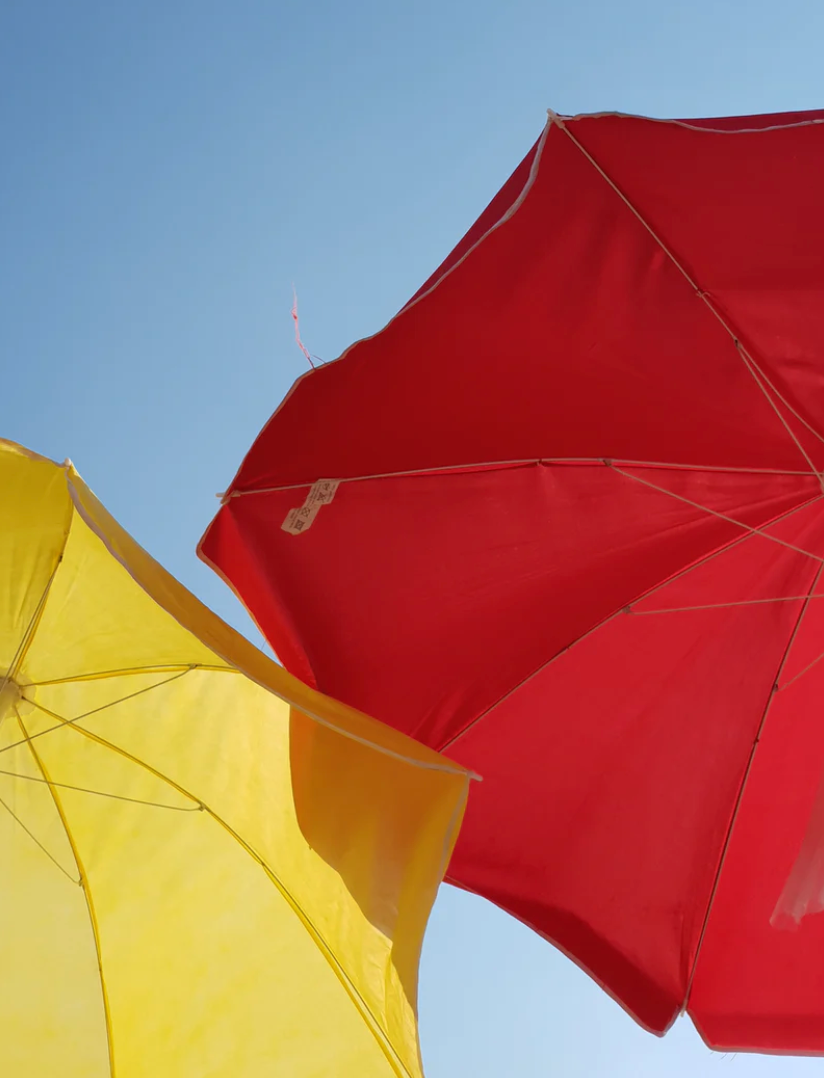 yellow and red beach parasol